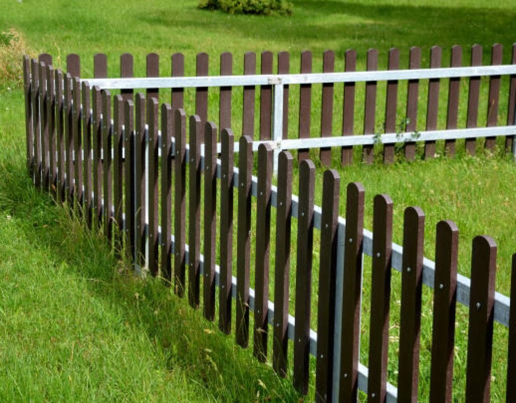 White vinyl privacy fence installed by Southern Fence Installations in Bay St. Louis backyard